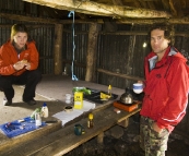 Lisa and Chris sheltering themselves for lunch in the Howitt Plains Hut