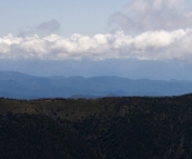 The Razorback Trail with Mount Bogong in the clouds in the distance