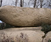 Lisa holding up one of the boulders near the Old Galleries Walk