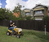 Sam helping with the yard work at the Detmold house in Echuca