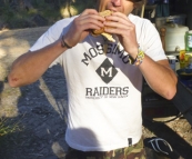 Chris enjoying the best bacon and egg sandwich ever at Strachans campground