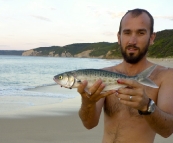 Sam with an early morning Salmon Trout at Johanna Beach