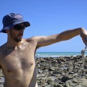 Sam holding dinner (an octopus) at Quondong Point