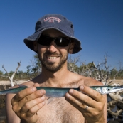 Sam catches a Snook fishing off the rocks north of Pago