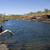 Lisa diving into the swimming hole at the top of Mitchell Falls