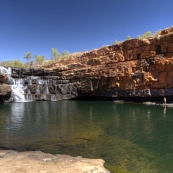 Lisa standing next to the Bell Gorge plunge pool