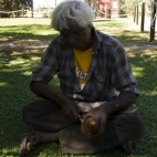 A local carving Boab nuts in Fitzroy Crossing