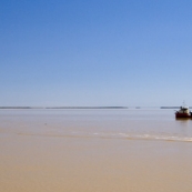 A cargo ship (right) coming in for a load of minerals