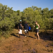 Lisa with two of the Aboriginal fellows from Gambanan on the way through the mangroves