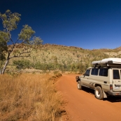 Driving into Purnululu National Park with the Osmand Range in the distance