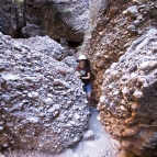 Walking through the boulders into Mini Palms Gorge