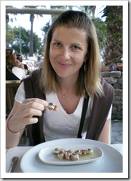 Lisa enjoying on of her favorite mezes: olives wrapped in anchovies