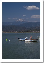 Fishing boats in Fethiye Bay with snow-capped peaks in the distance