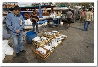 Fisherman pedaling their wares in the marina at Bodrum