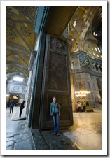 Lisa standing in front of the gigantic Imperial Door separating Aya Sofya's main dome from the inner narthex