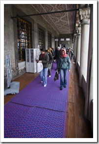 Lisa covered up on her way into the Blue Mosque