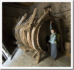 Lisa next to Moni Varlaam's wine barrel!