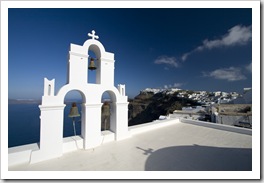 Church bells in Firostefani and the town of Imerovigli in the distance