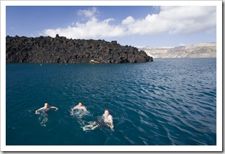 Squino, ET and Pete swimming off of Nea Kameni with Santorini in the background