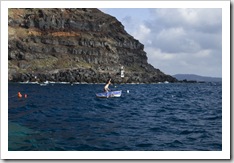 Sam finds a small fishing boat in the Ammoudi harbor