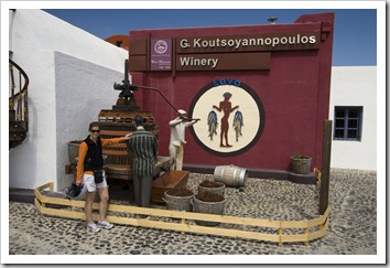 Lisa in front of an old press at Koutsoyannopoulos Winery