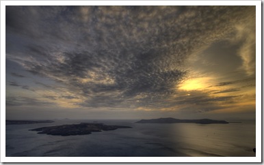 Sunset over Nea Kameni and Thirasia: the quiet before the storm