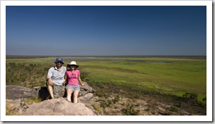 Sam and Lisa on the edge of the sandstone escarpment with wetlands below at the Ubirr Aboriginal art site