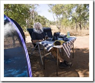 Sam having an afternoon beer and working on the blog in his fly net