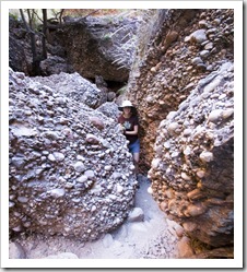 Walking through the boulders into Mini Palms Gorge