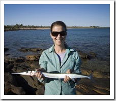 Lisa catches a Snook fishing off the rocks north of Pago