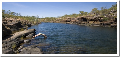 Lisa diving into the swimming hole at the top of Mitchell Falls