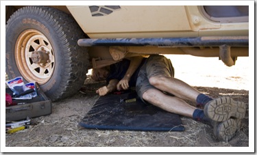 Sam repairing the water tank at our campsite next to the Gibb River