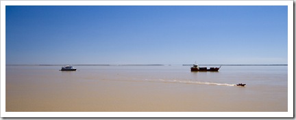 A cargo ship (right) coming in for a load of minerals