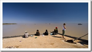 Lisa at the end of the Derby wharf with some local Aboriginal women fishing for dinner