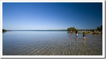 Lisa with two of the Aboriginal fellows from Gambanan wading the mudflats in search of crabs