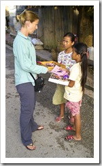 Lisa bargaining with some girls on the streets of Luang Prabang
