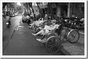 Cyclo drivers waiting out the mid-afternoon rain