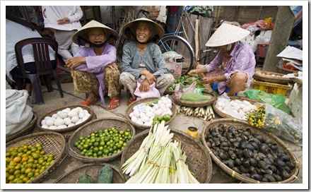 Locals peddling their wares in Hoi An's central market