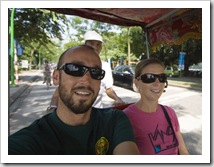 Sam and Lisa in a cyclo taking a tour across Hanoi