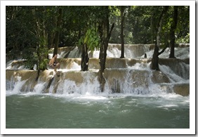 Sam jumping off Tad Sae Waterfall