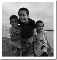 Some of the local boys horsing around next to the Mekong