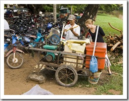 Lisa learning how pressed sugarcane juice is made