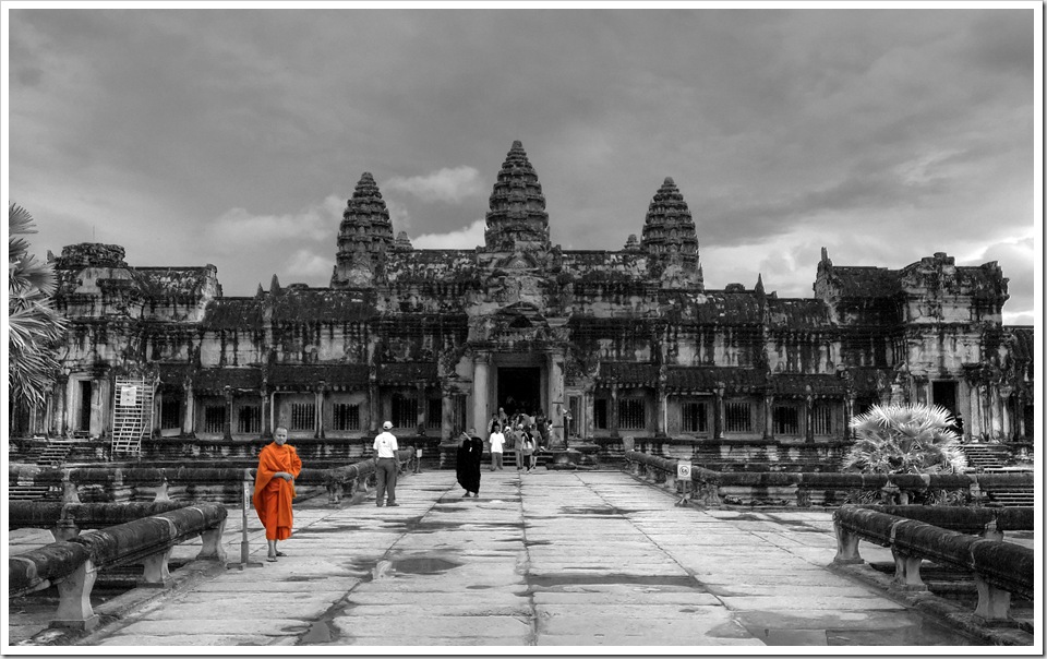 Monk standing at the entrance to Angkor Wat