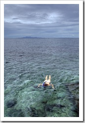 Lisa snorkeling at Cape Jeda Gang with Ko Phangan in the distance