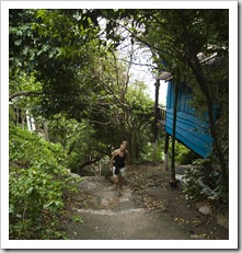 Lisa walking up the steps from the beach at Cape Jeda Gang