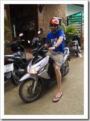 Sam on the little moped we rented for our time in Phuket