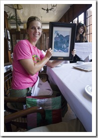 Lisa holding the menu at Cafe Batavia