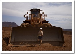 Lisa in front of a retired dozer's shovel