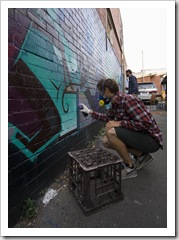 Working on the graffiti wall down the side of Mi-Life shoe store