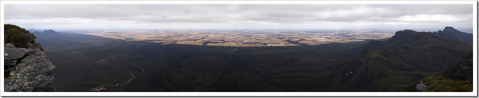 Panoramic of the northern side of Stirling Range National Park and the wheat fields beyond from the top of Bluff Knoll